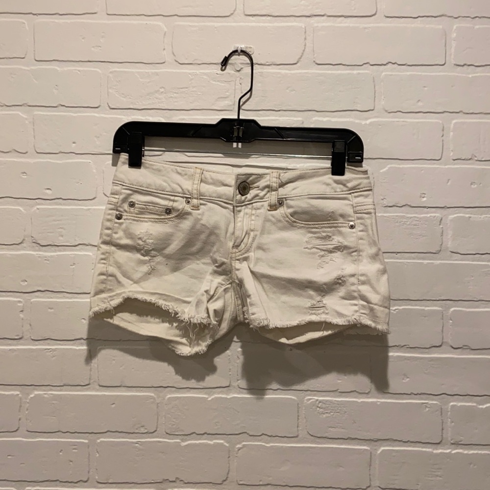 distressed white cutoff denim shorts